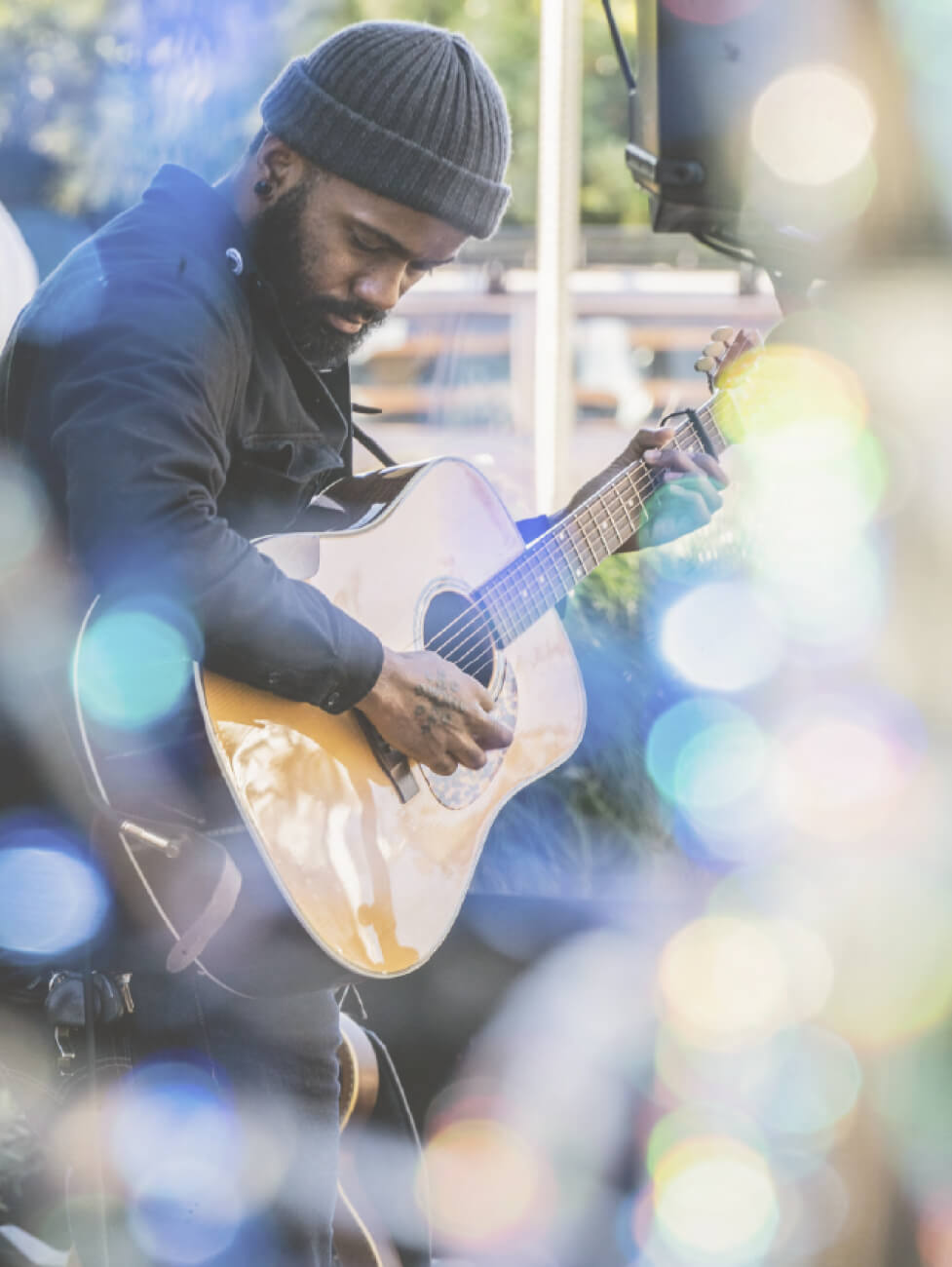 Man playing guitar on South Congress street in Austin