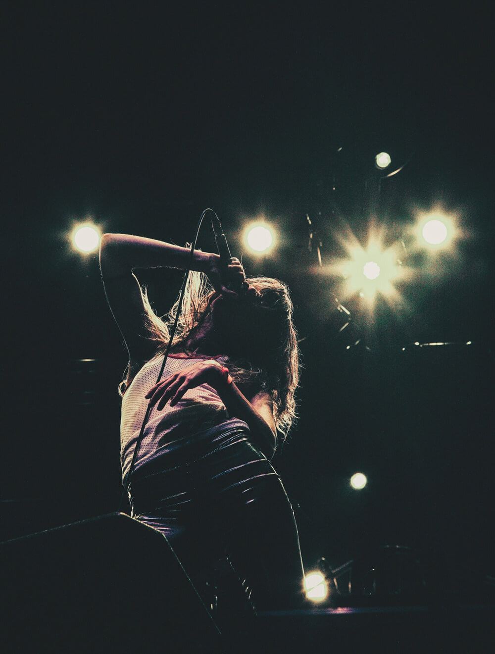 Female singer performing on stage in South Congress Austin