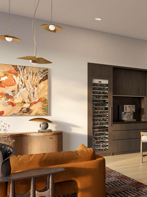 Luxury penthouse residences at Leland South Congress showcasing elegant modern interior design with a stylish orange sofa, contemporary lighting fixtures, and a wine storage area.